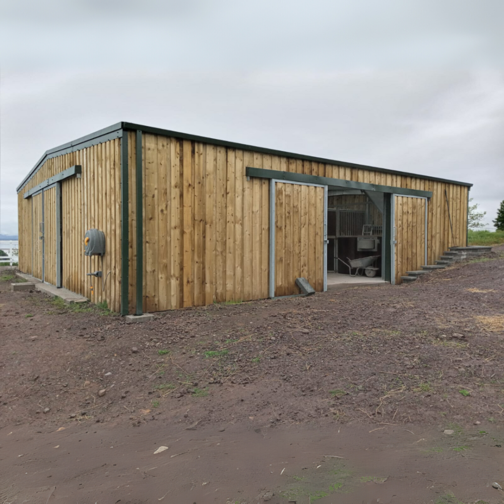 A timber-clad agricultural building from Kit Buildings UK