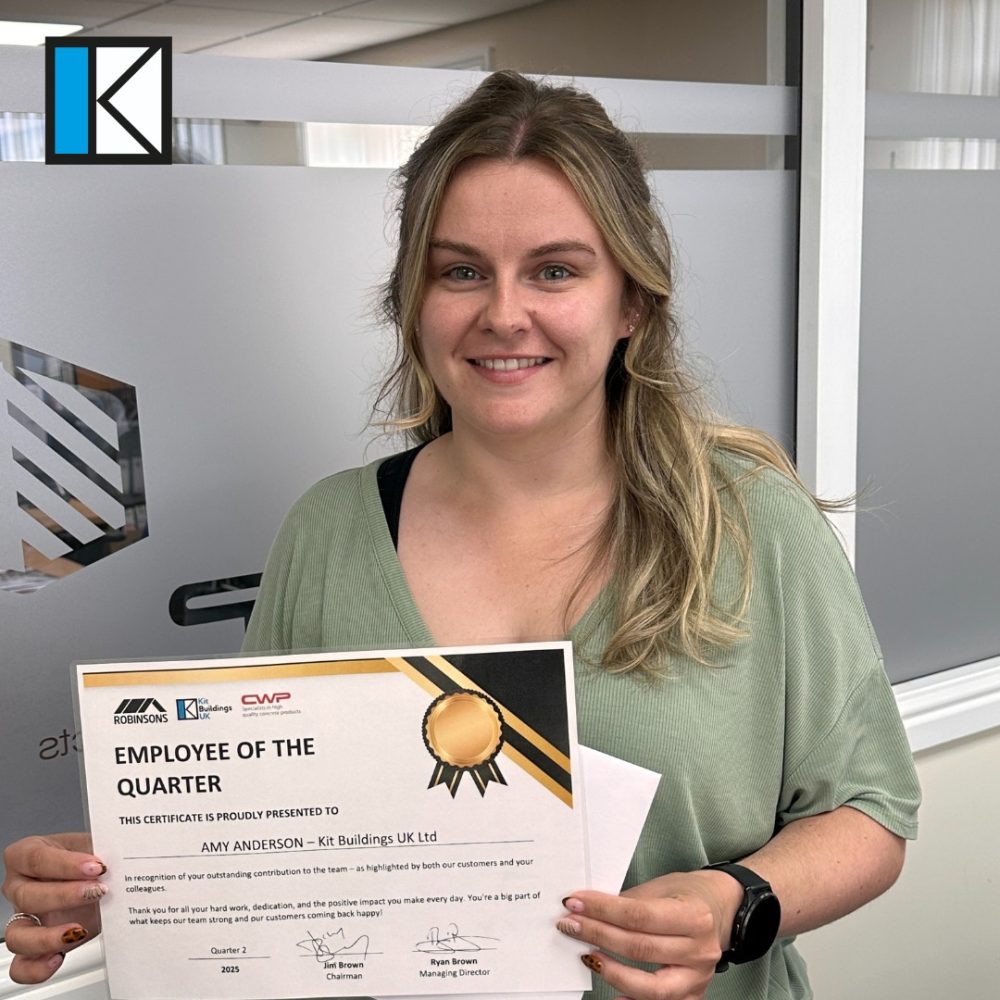Amy Anderson with her employee of the quarter certificate